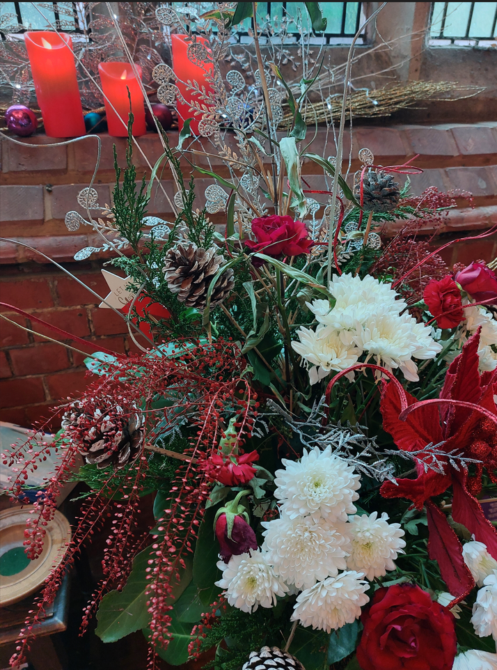 Flowers at Christmas, in colours of red, white, green and silver.